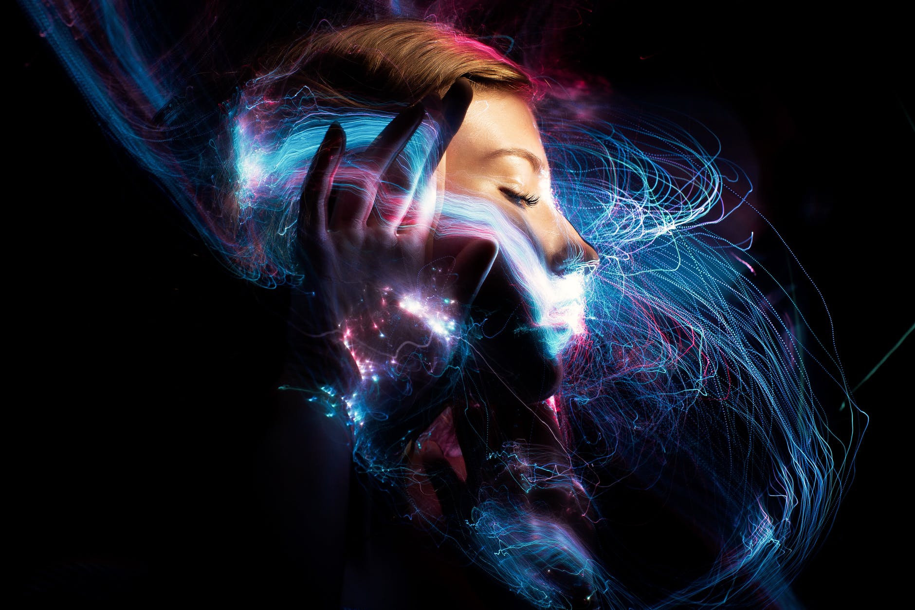 A face within a flurry of matrix threads.